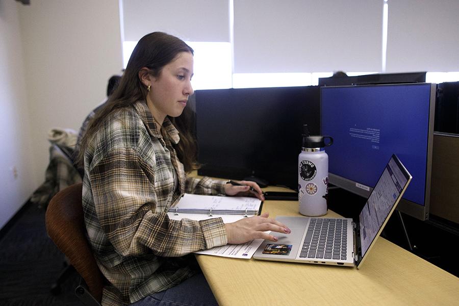 A student works on their laptop.